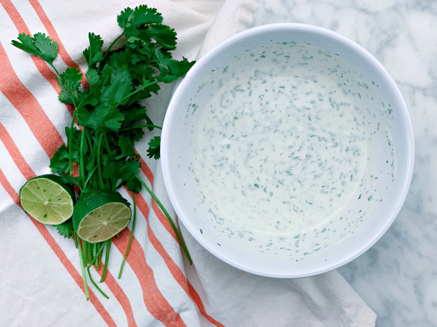 The best summer sauce! This Cilantro Yogurt Sauce has so much flavor with the freshness of cilantro and the bright flavors of fresh squeezed lime juice. Perfect for rice bowls, tacos, and salads!