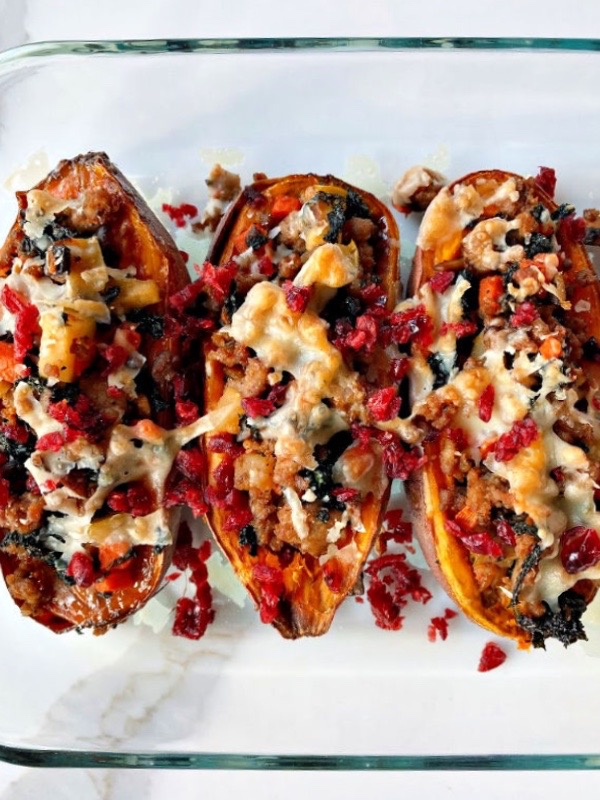 Stuffed sweet potatoes with parmesan cheese and dried cranberries.