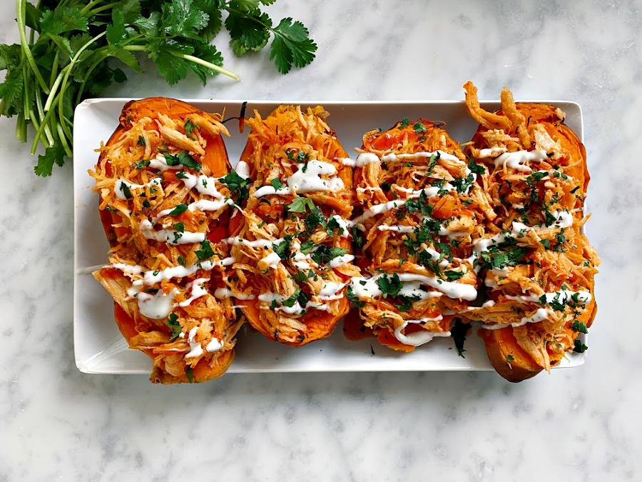 These stuffed sweet potatoes have juicy chicken tossed in a sweet and spicy sauce that is mouthwatering!
