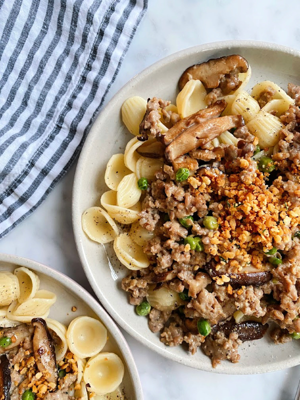 This creamy Italian Sausage Pasta is mouthwatering and hearty. Packed with roasted mushrooms and spring peas along with a velvety dollop of mascarpone cheese. It is the perfect comfort meal!