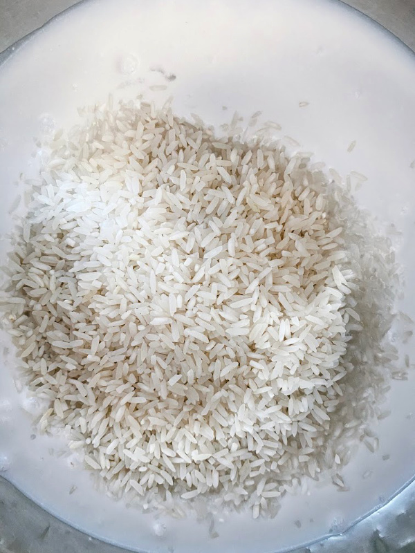 Coconut rice in the Instant Pot comes together in less than 60 seconds and cooks in 7 minutes! Perfect to serve with stir fry recipes, curries, or with fresh mango!